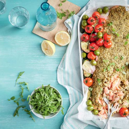 Pesto-crusted salmon with tomatoes and olives