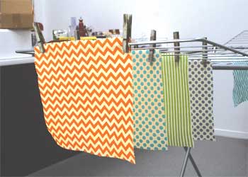 Beeswax wraps drying on clothes horse Beeswax wraps drying on clothes horse