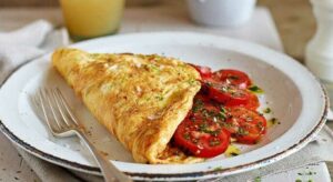 Herby cheese and tomato omelette