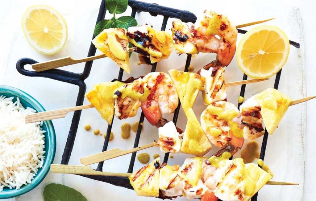 Seafood and pineapple skewers with coconut-curry sauce Seafood and pineapple skewers with coconut-curry sauce