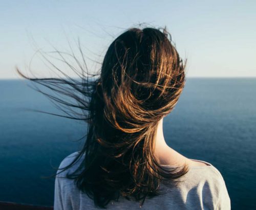 Woman feeling calm looking at the sea