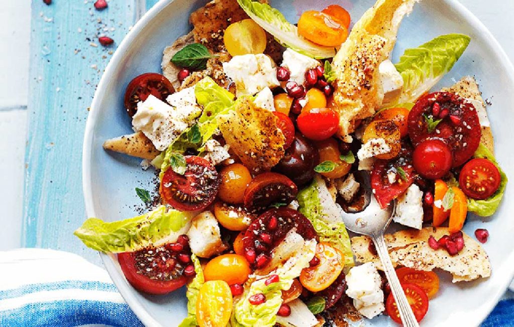 Mixed tomato and feta fatoush salad with za’atar and pomegranate Mixed tomato and feta fatoush salad with za’atar and pomegranate