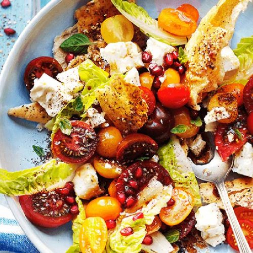 Mixed tomato and feta fatoush salad with za’atar and pomegranate