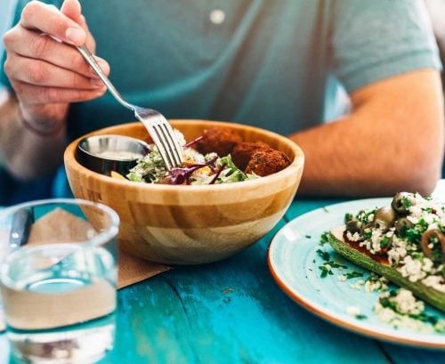 Man eating vegan meal