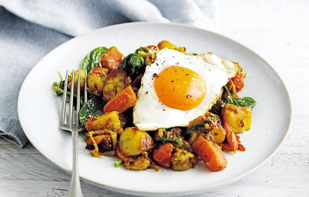 Indian-spiced bubble and squeak with fried eggs Indian-spiced bubble and squeak with fried eggs