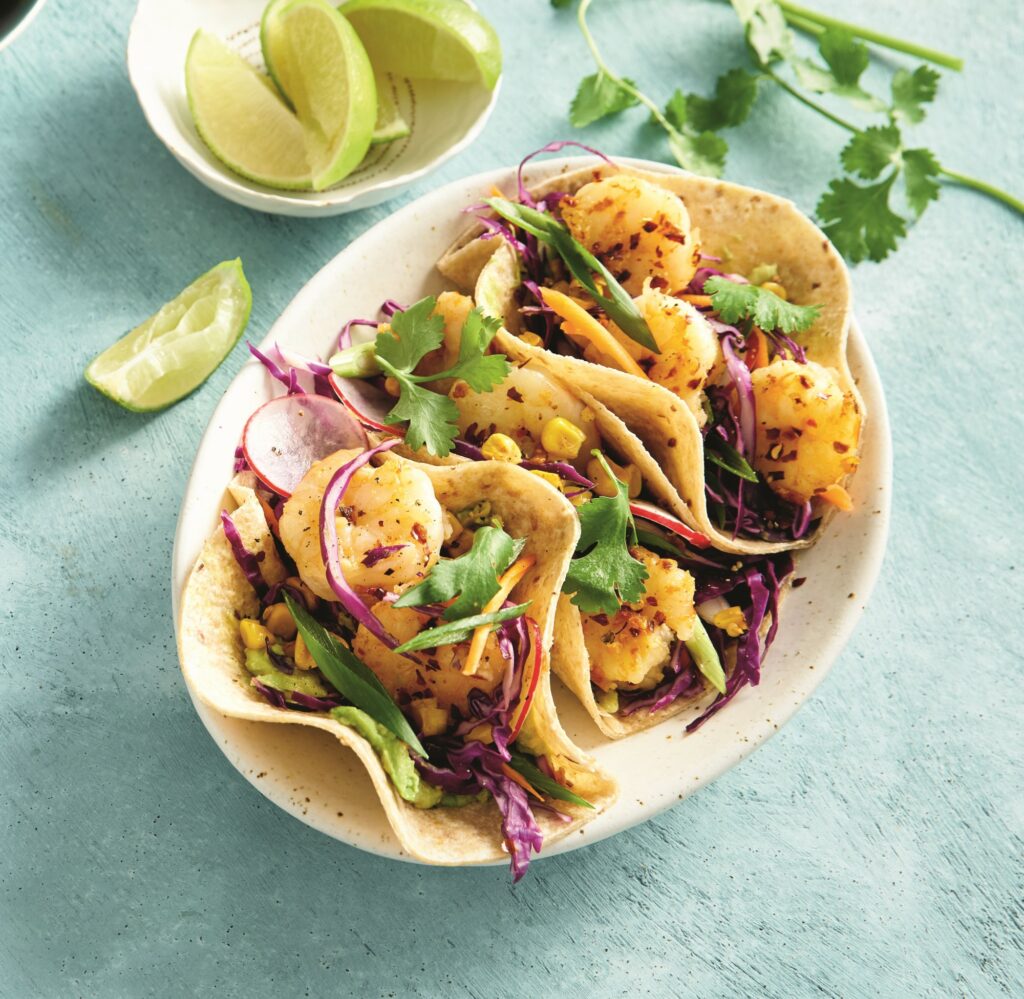 Prawn tacos with charred corn, cabbage and avocado Prawn tacos with charred corn, cabbage and avocado
