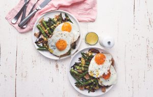 Warm fried egg and asparagus salad