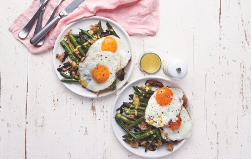 Warm fried egg and asparagus salad