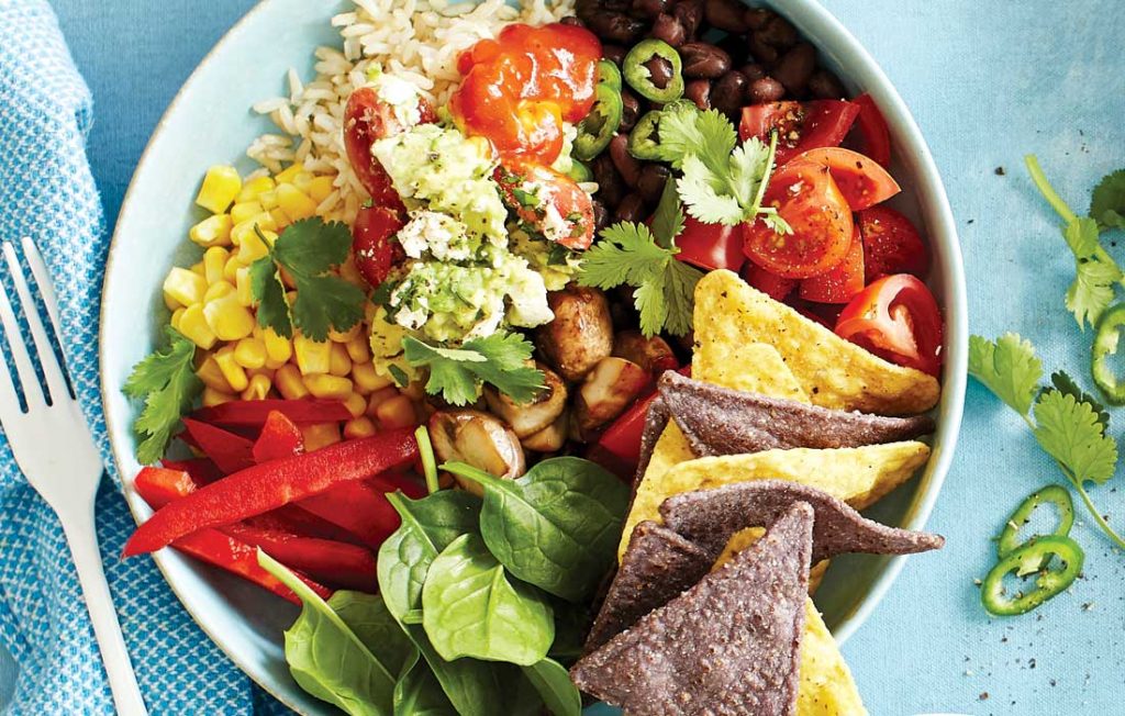 Black bean and mushroom burrito bowls topped with fully loaded guacamole Black bean and mushroom burrito bowls topped with fully loaded guacamole
