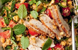 Spice-crusted chicken on chickpea and walnut salad