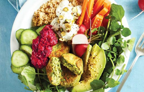 Super-green falafel bowl topped with beetroot hummus