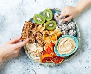 Can in-between meal snacks help with portion control?