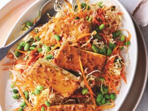 Baked tofu with satay sauce, edamame and kimchi slaw