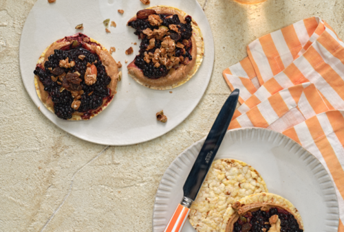 Almond butter, smashed blackberries and granola