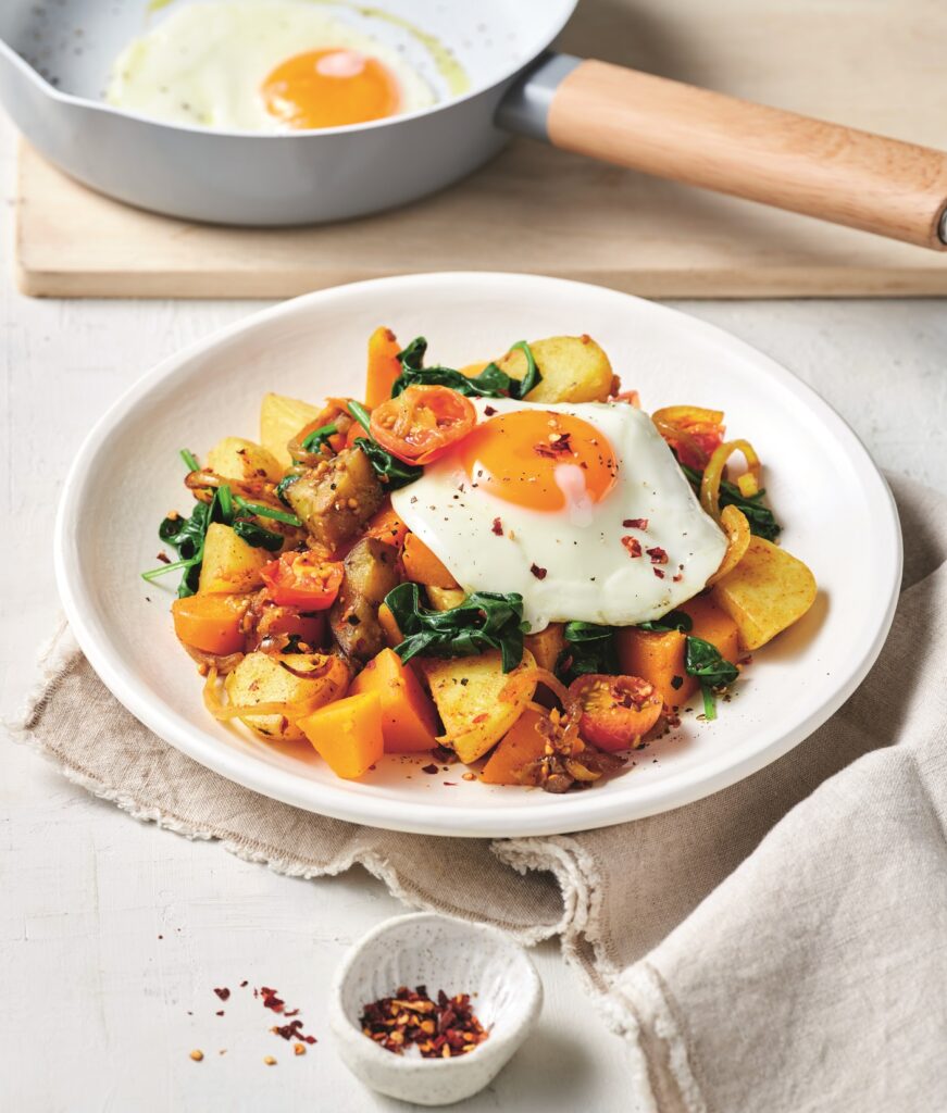 Indian-spiced bubble and squeak with fried eggs Indian-spiced bubble and squeak with eggs