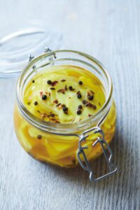 Turmeric-pickled cauliflower stems