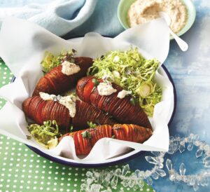 Hasselback sweet potatoes with vegan cheese sauce